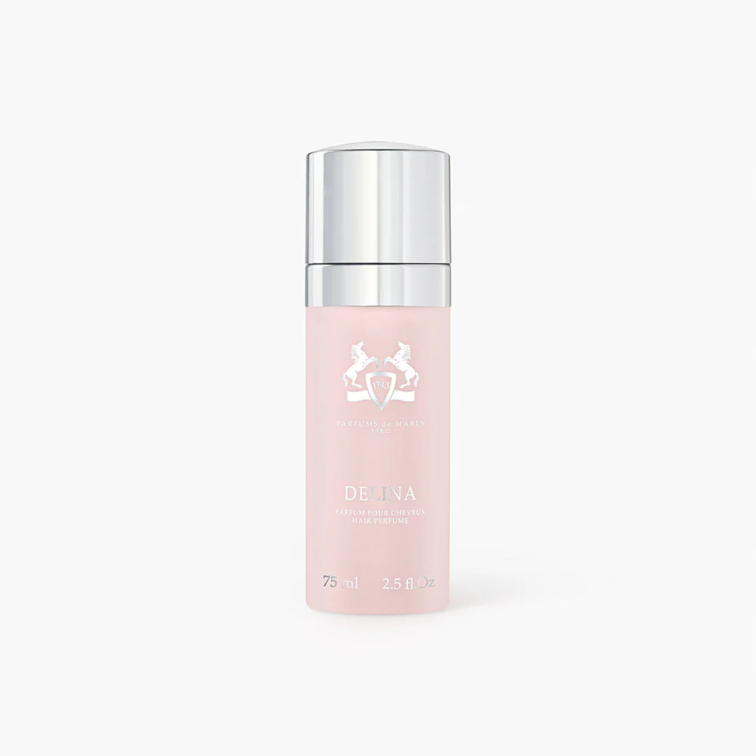 Pink hair perfume bottle with silver cap on a white background. The spray is called Delina by Parfums de Marly
