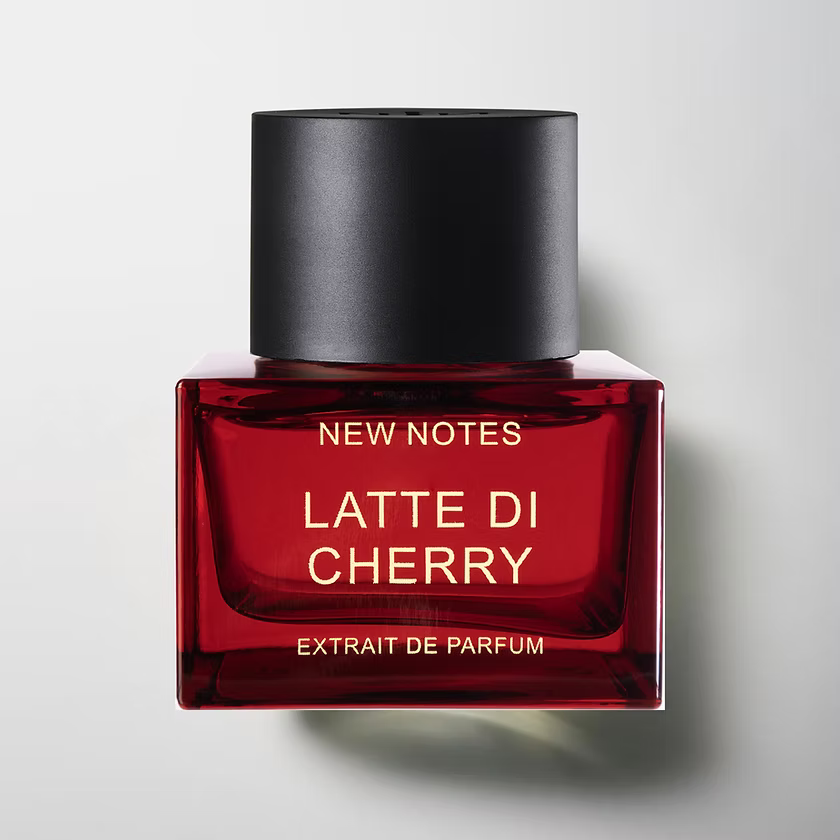 Latte di Cherry by New Notes. Red perfume bottle with black cap labeled 'Latte Di Cherry' on a light gray background