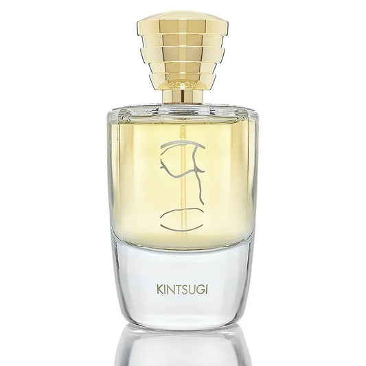 Kintsugi by Masque Milano Perfume rectangular bottle with gold cap and clear body on a white background