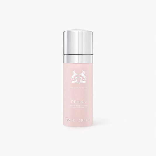Pink hair perfume bottle with silver cap on a white background. The spray is called Delina by Parfums de Marly