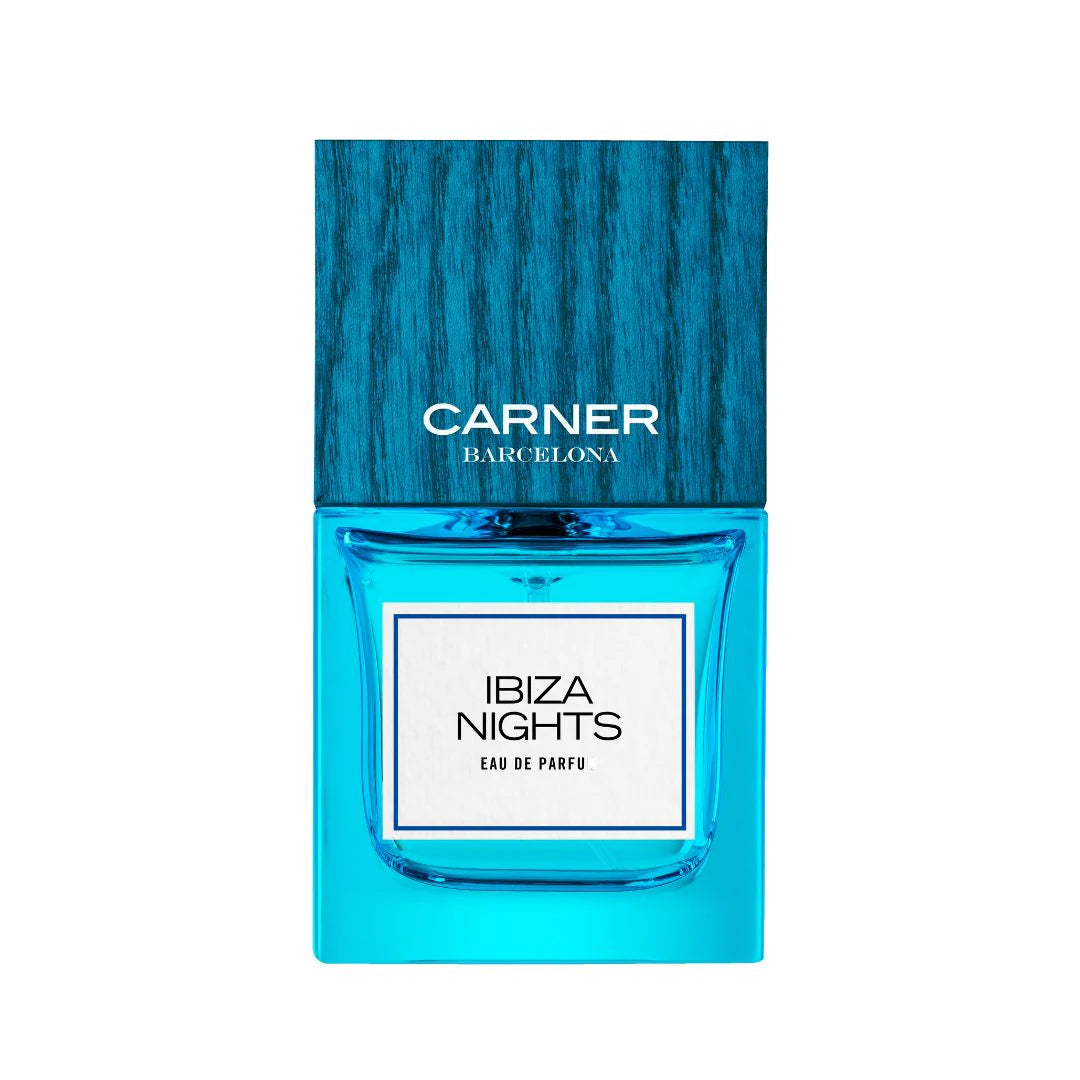 Blue perfume bottle labeled 'Ibiza Nights' by Carner Barcelona on a white background