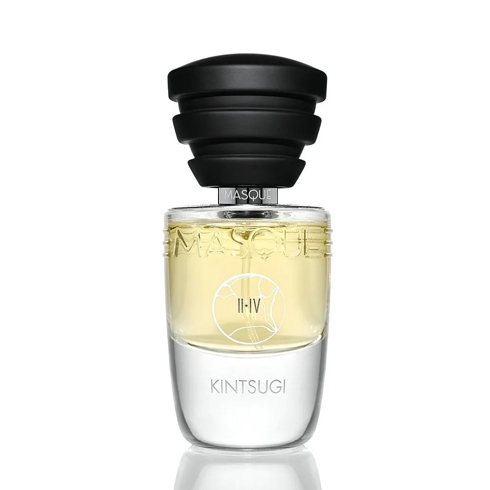 Kintsugi by Masque Milano Perfume bottle with black cap and clear glass body on a white background