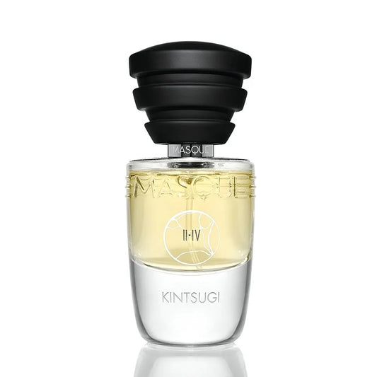 Kintsugi by Masque Milano Perfume bottle with black cap and clear glass body on a white background