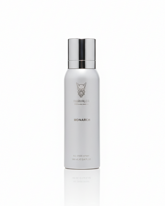 White bottle with silver cap on a white background. It's an all over body spray for hair and body, called Monarch by Marvalea