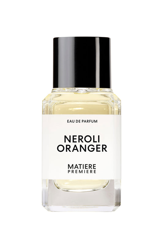 A bottle of Neroli Oranger eau de parfum by Matière Première, with a clear glass container and a black cap.