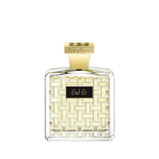 Perfume bottle with gold cap and 'Oud Or' label on a white background. this is a perfume with oud scent which is called Oud Or by Houbigant Paris