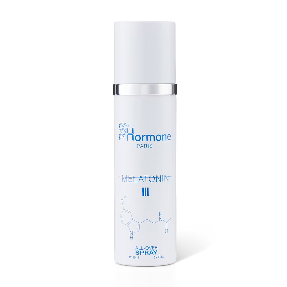 This is Not Melatonin III by Hormone Paris. White spray bottle labeled 'Melatonin' on a white background
