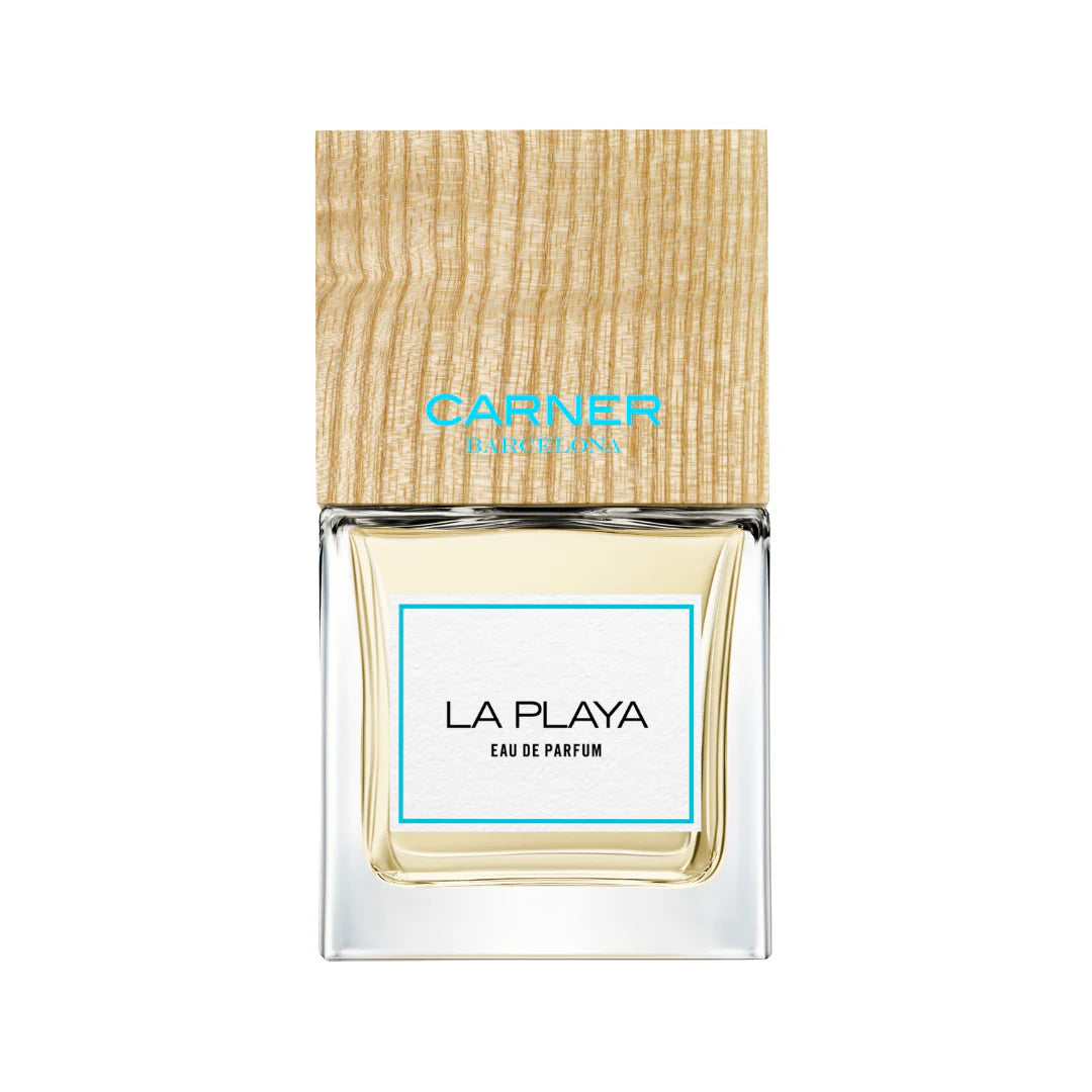 100ml clear glass bottle of Carner Barcelona La Playa with a white label and signature wooden cap.
