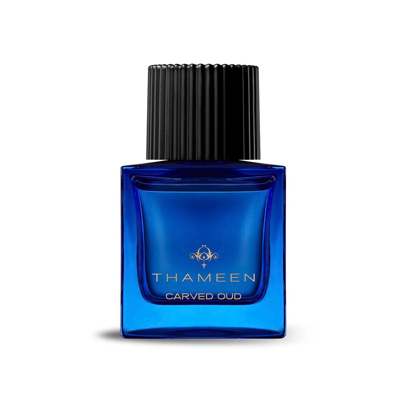 50ml royal blue square glass bottle with a gold Thameen logo and a textured black cylindrical cap.