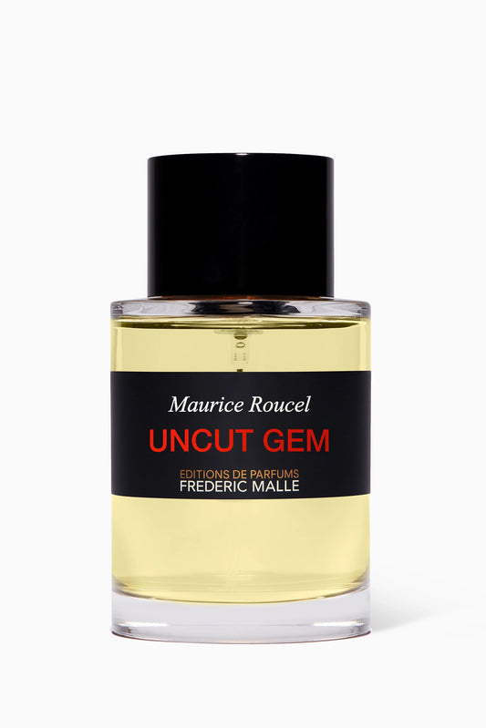 100ml clear cylindrical Frédéric Malle bottle with a minimalist black label and a magnetic black cap.