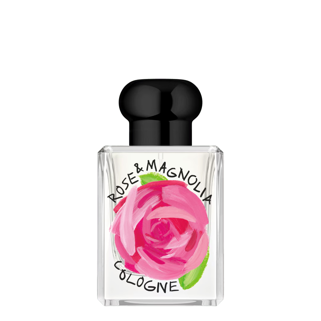 50ml clear Jo Malone Rose & Magnolia bottle with black cap and an artistic pink floral painting on the front.