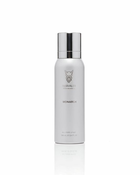 A 100ml sleek silver aerosol bottle of Marvalea Monarch All Over Spray from the Middle East, showcasing a black brand logo and a silver cap.