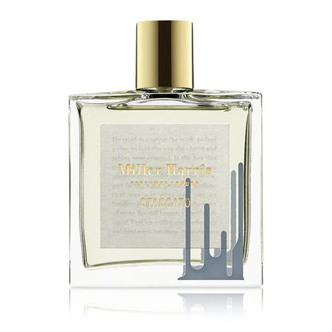 100ml square Miller Harris Staccato glass bottle with a gold cap and a grey-blue liquid drip design.