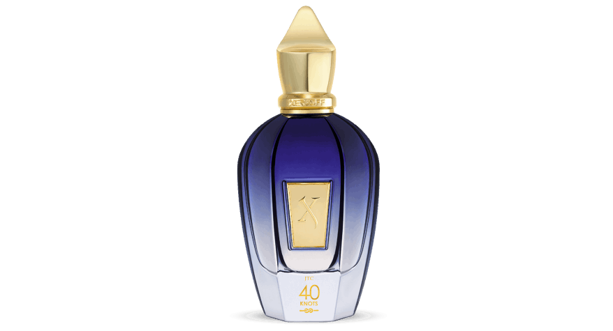 Xerjoff 40 Knots navy blue bottle with gold cap near the ocean, 100ml.