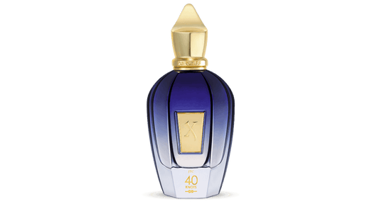 Xerjoff 40 Knots navy blue bottle with gold cap near the ocean, 100ml.