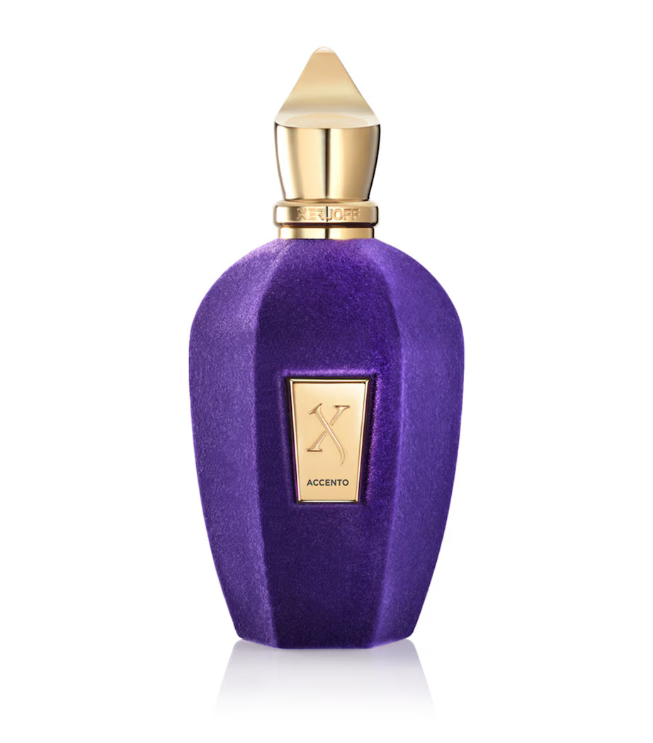 A 100ml purple velvet-coated glass bottle of Xerjoff Accento Eau de Parfum from Italy, featuring a gold-toned logo plaque and a signature pointed gold cap.